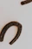 Close-up of a freshly fitted horseshoe glowing from hot shoeing on a horse's hoof.