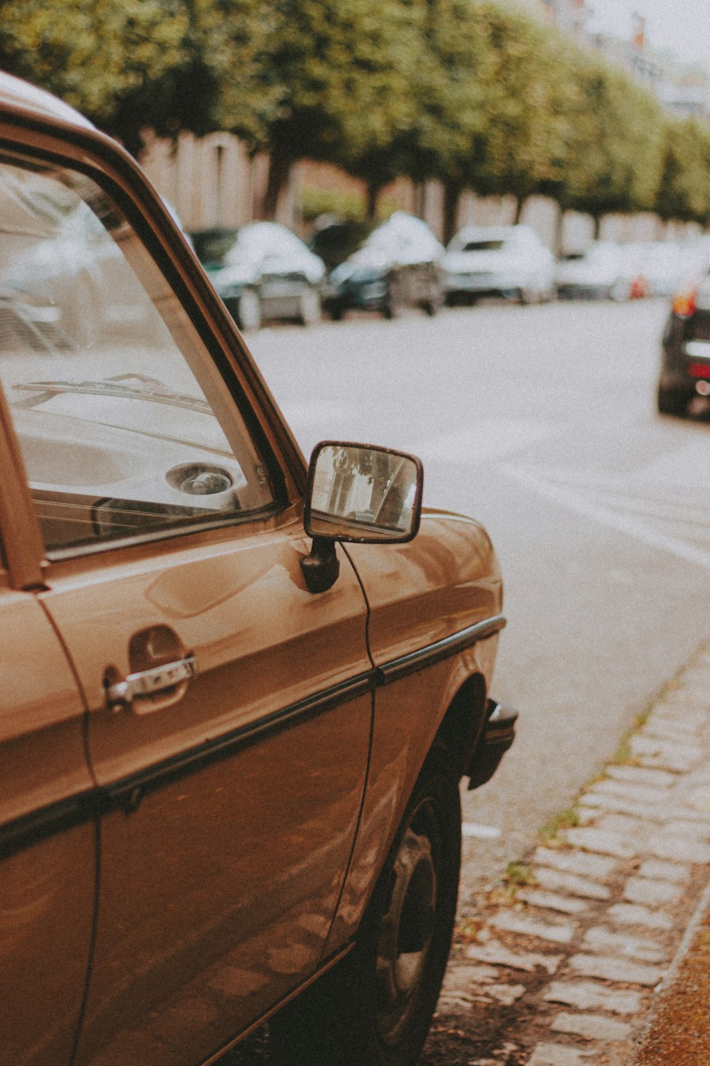 brown car on the road during daytime