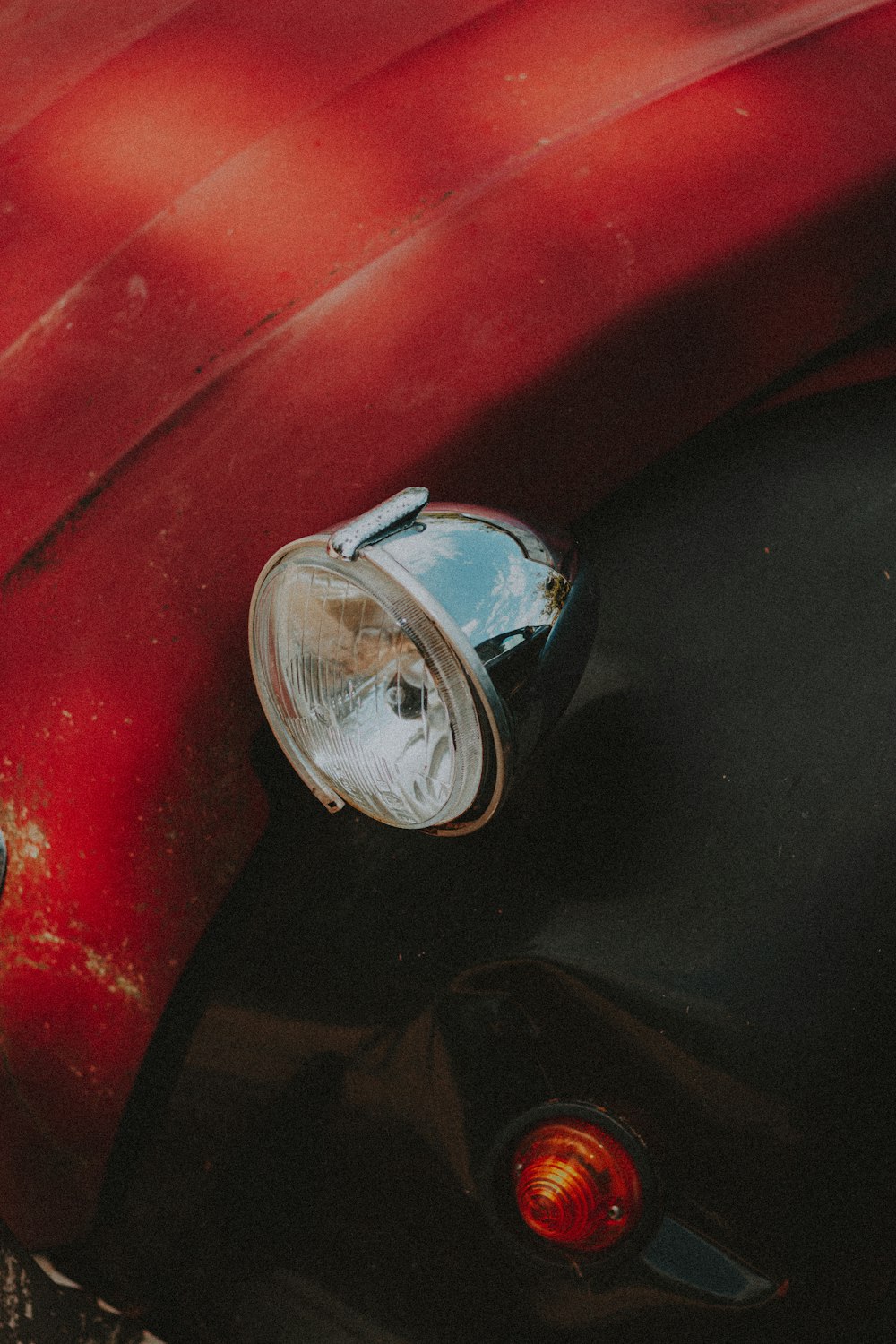 red car with silver headlight