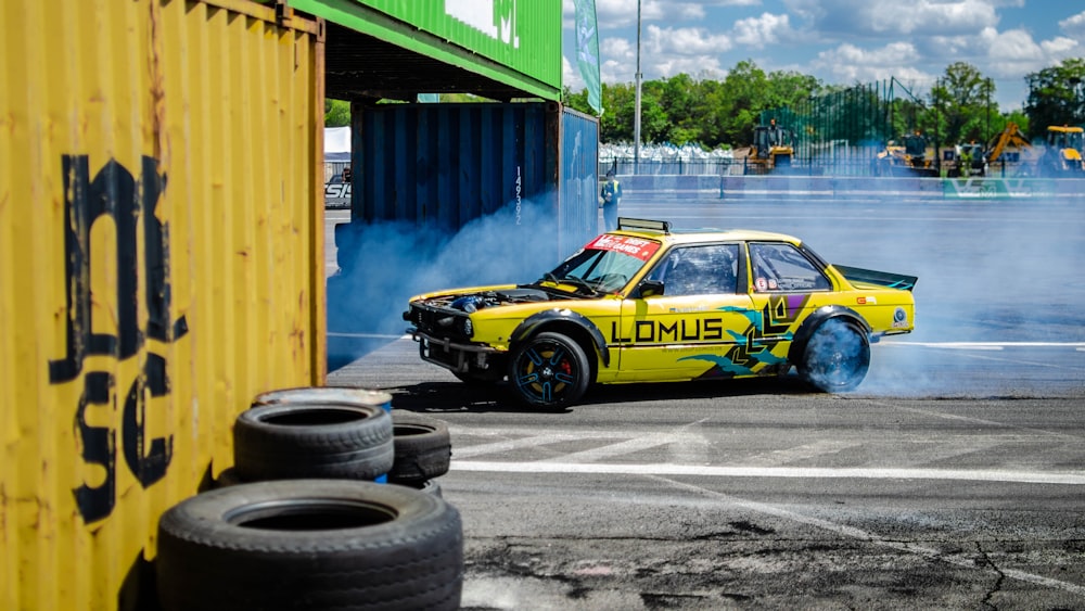 black and yellow sports car on gray concrete road