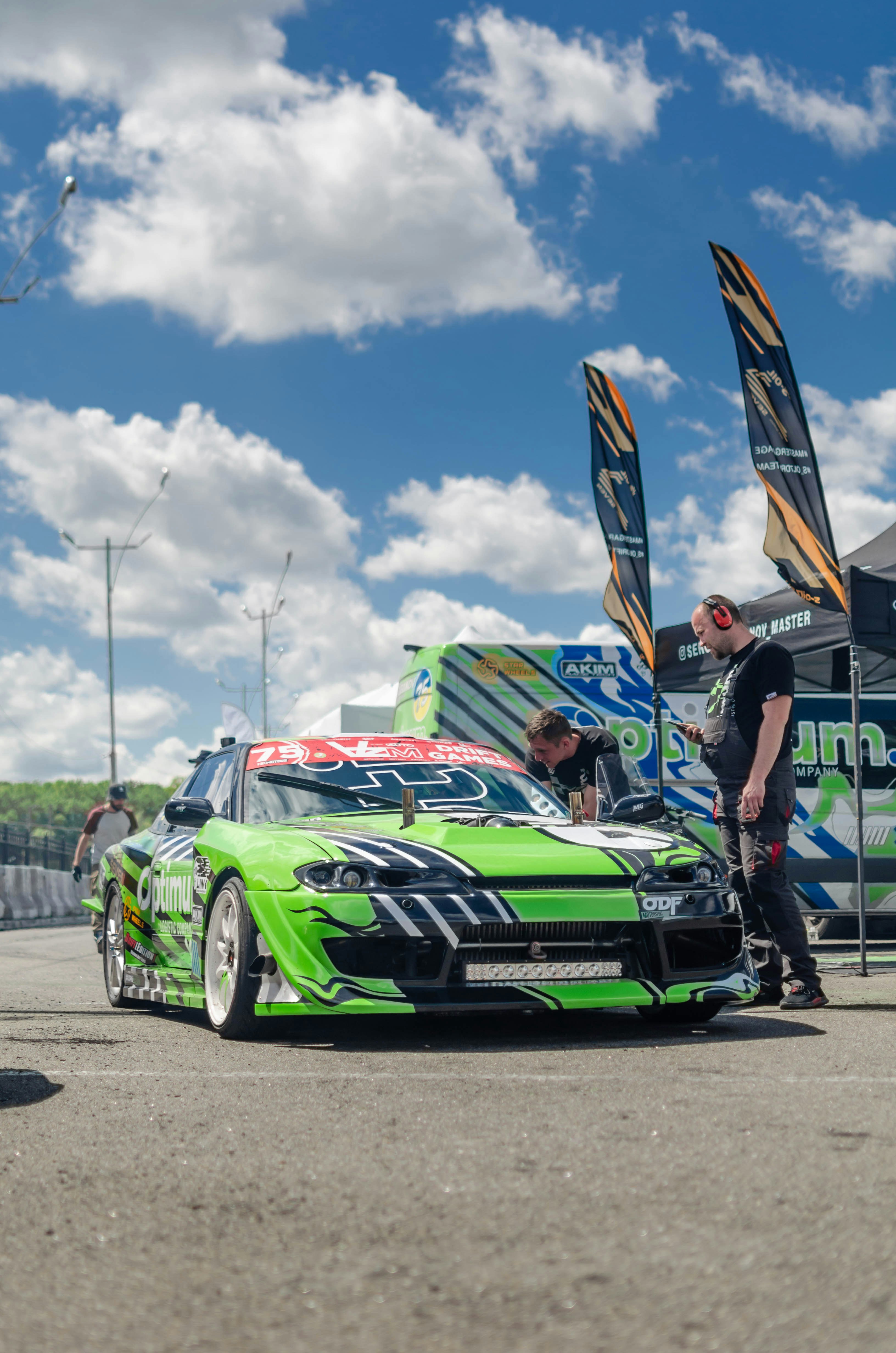 Green and black chevrolet camaro on track field