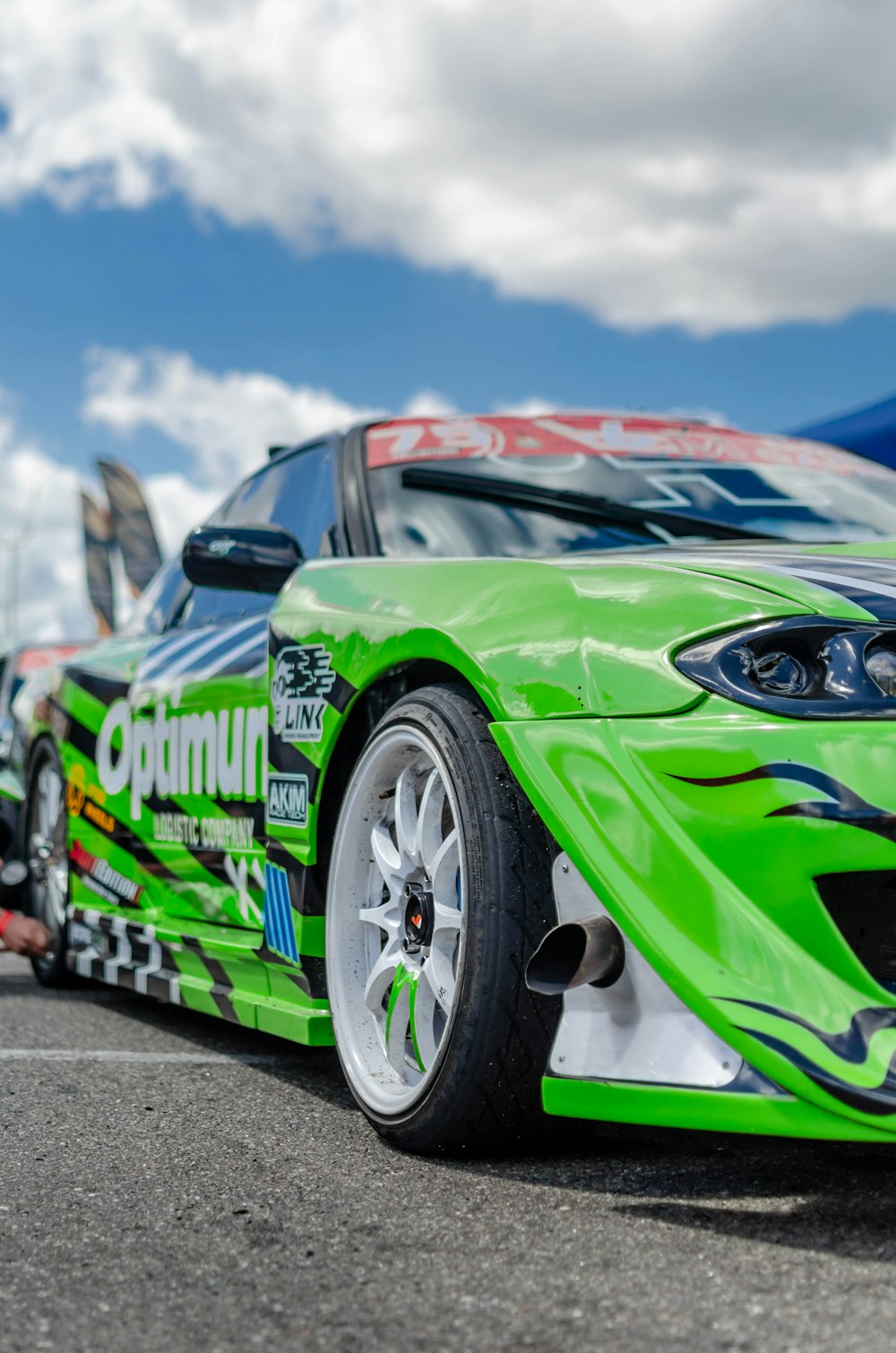 green and blue bmw m 3 coupe on road during daytime