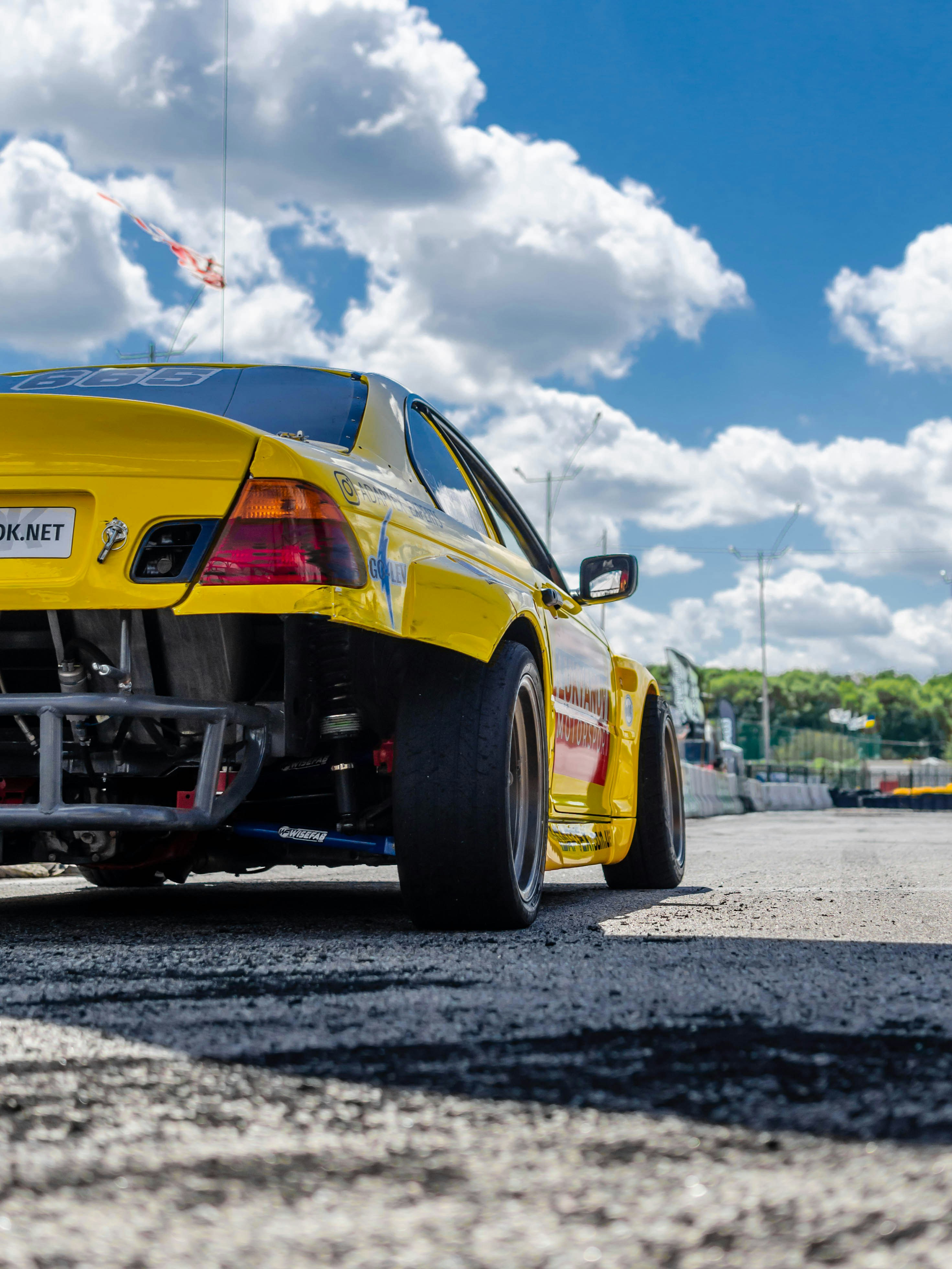 Red And Yellow Porsche 911 On Road Under Blue Sky And White Clouds During Daytime Photo Free Bmw E46 Image On Unsplash