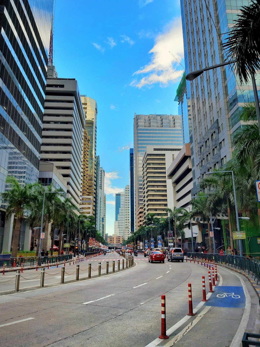 people walking on pedestrian lane near high rise buildings during daytime