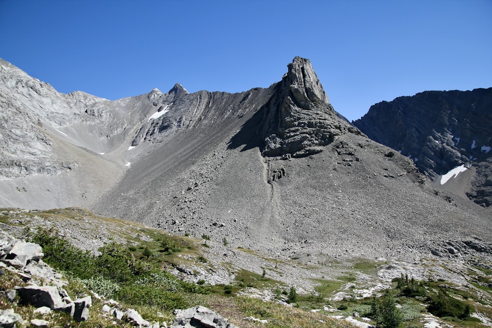 gray rocky mountain under blue sky during daytime