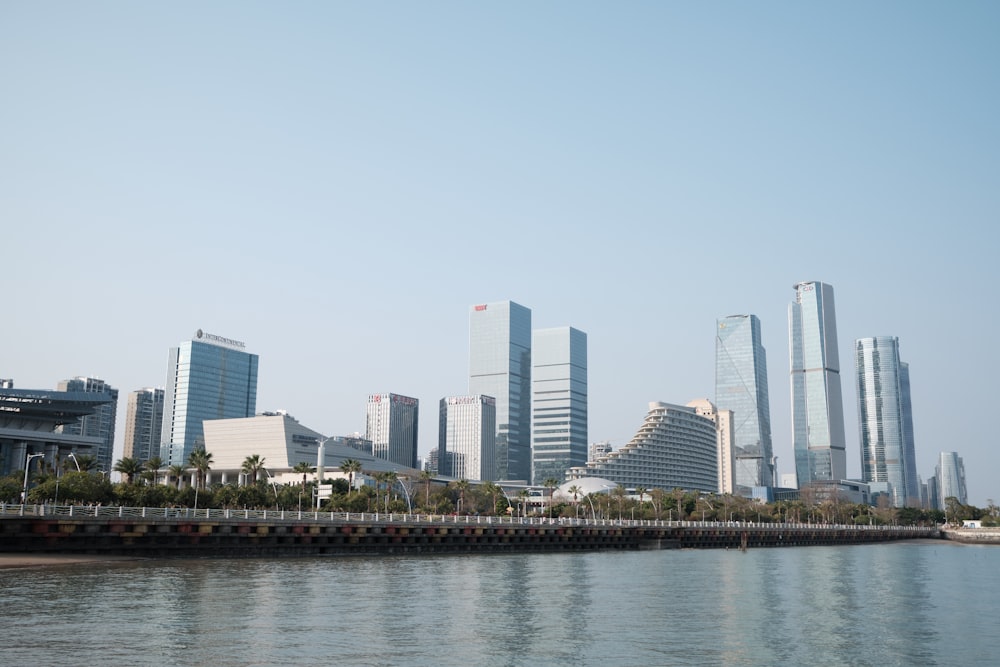 city skyline across body of water during daytime