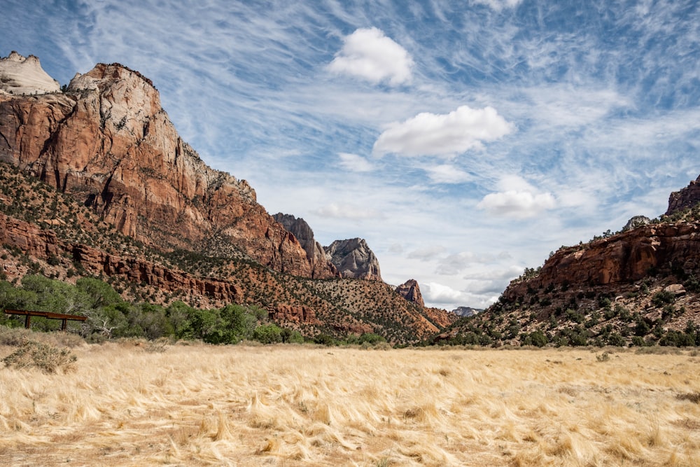 brown rocky mountain under blue sky during daytime