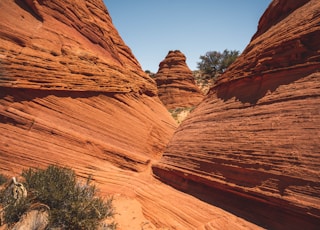 brown rock formation under blue sky during daytime