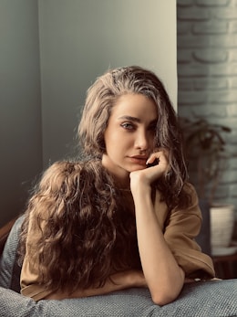 woman in brown leather jacket