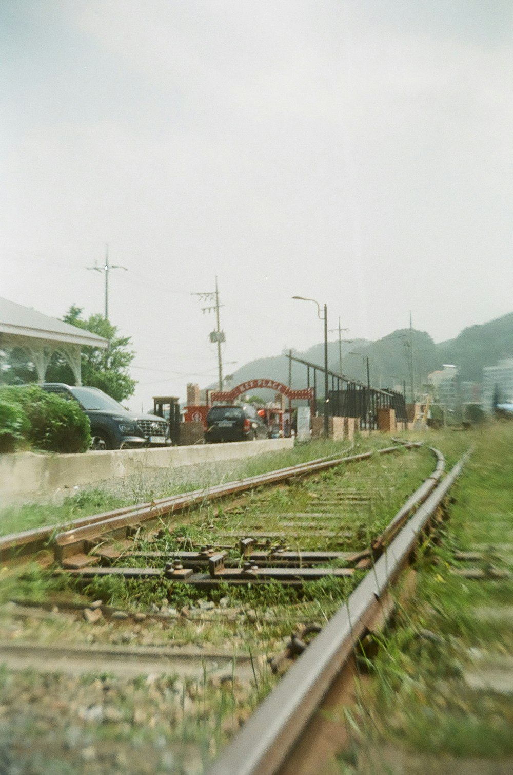 red train on rail road during daytime