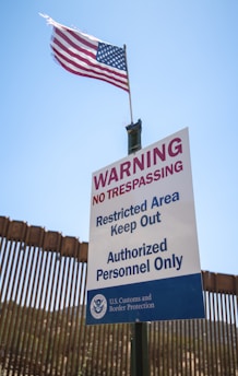 a sign warning of trespassing and restricted area