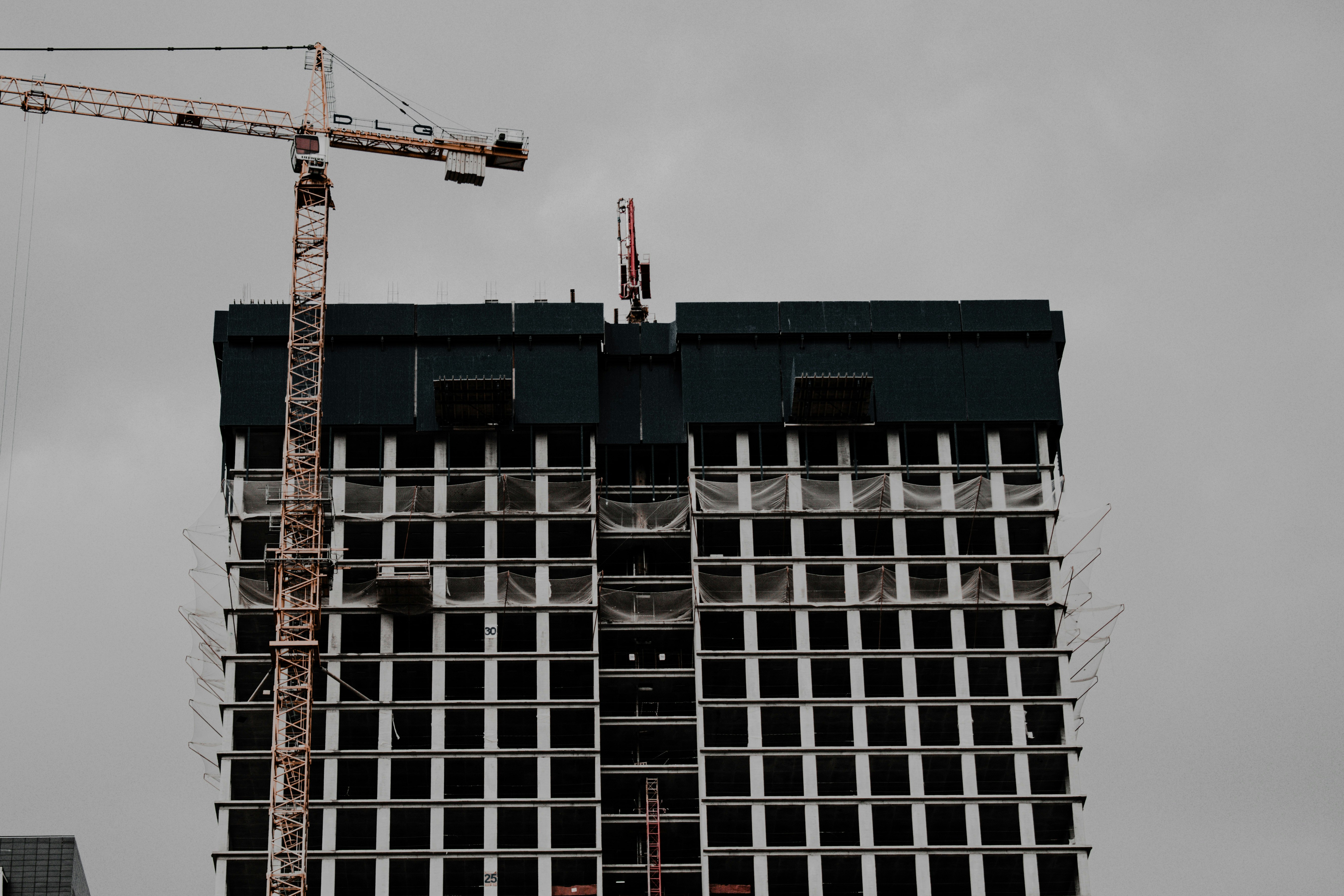 blue and white building with red crane