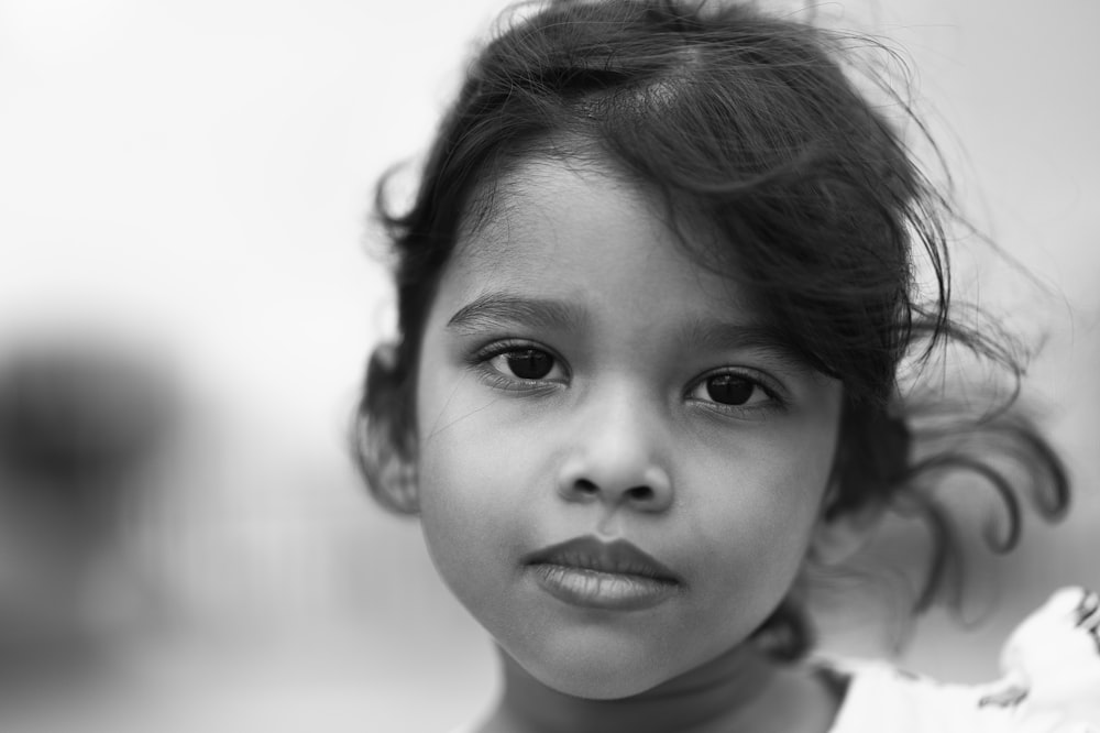 grayscale photo of girl in crew neck shirt