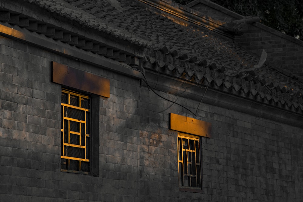 brown wooden window on gray concrete building