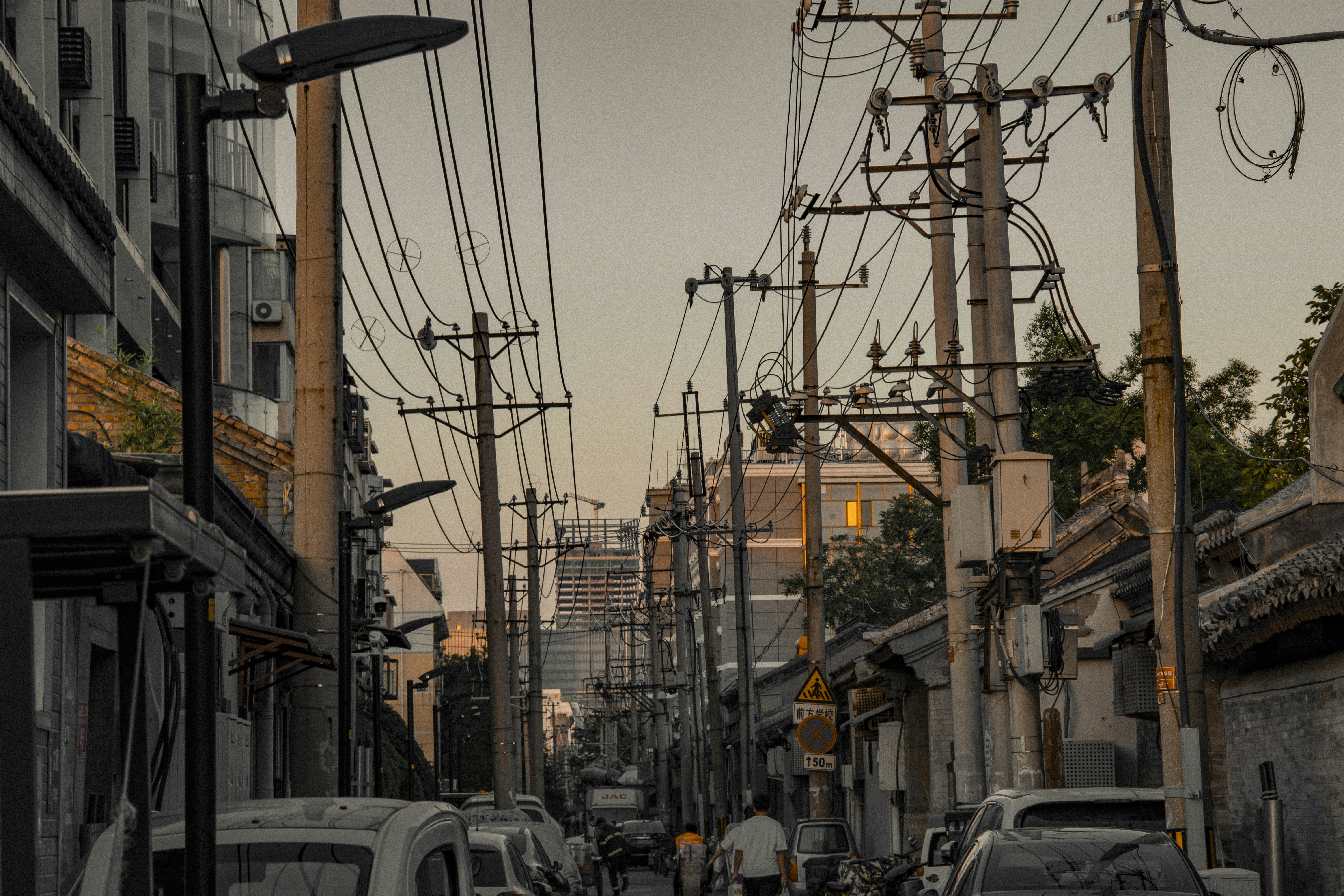 cars parked on side of the road during daytime, 