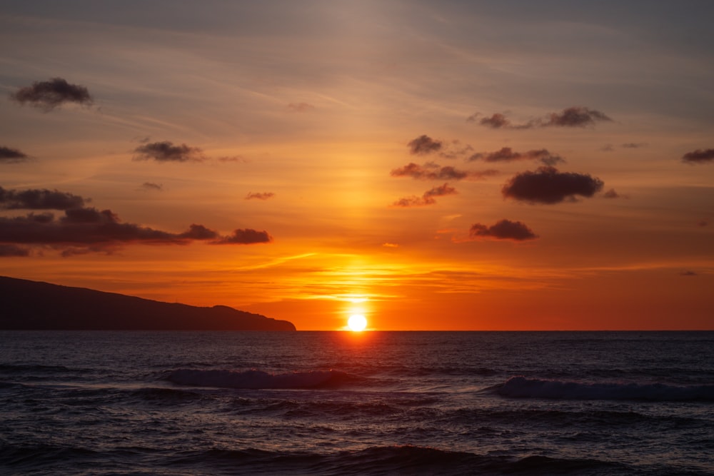 body of water during sunset