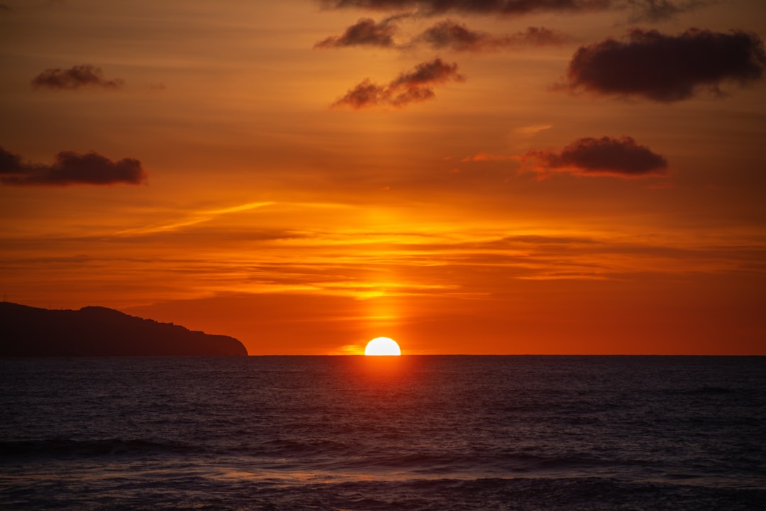 body of water during sunset