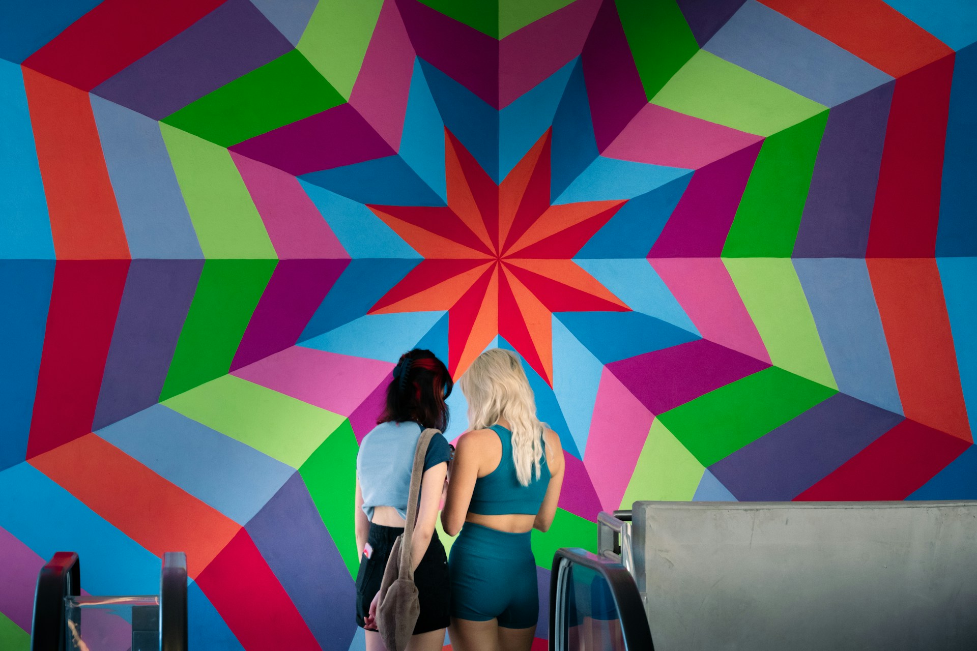 2 women sitting on chair