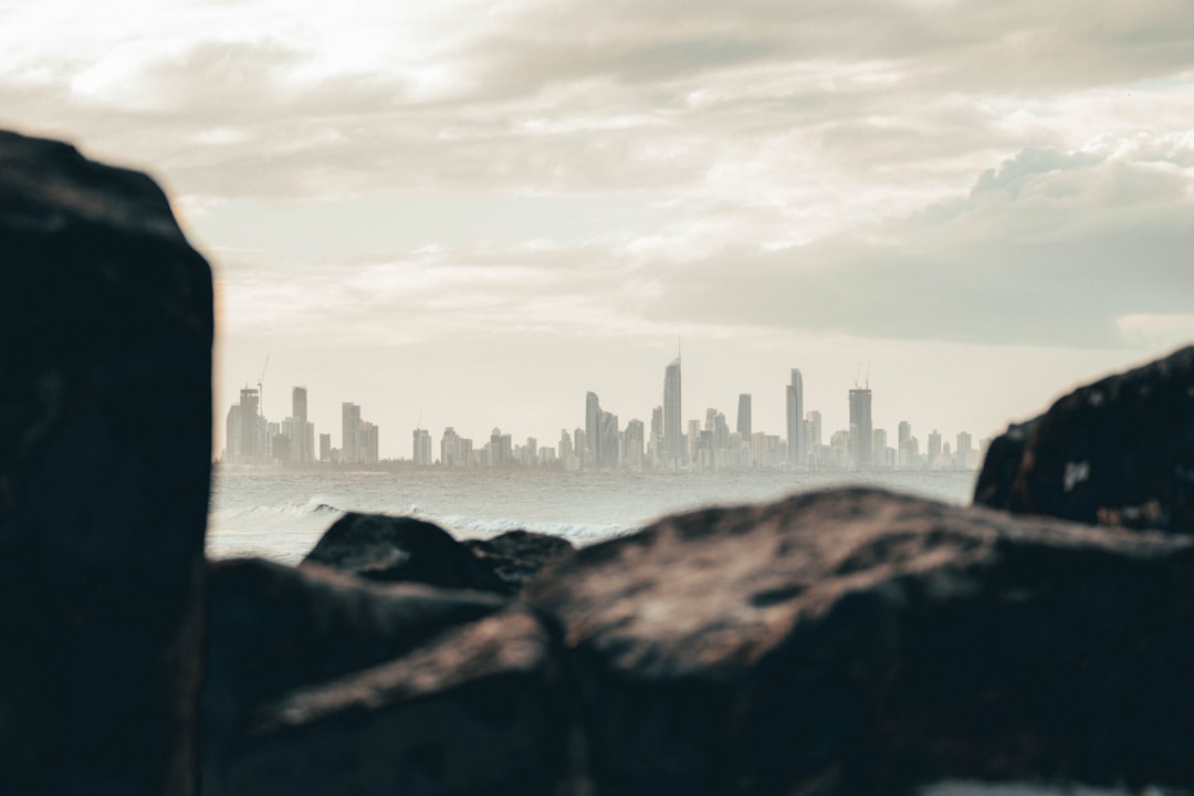 city skyline under white clouds during daytime