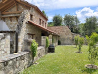 Charming Mafra countryside estate surrounded by lush greenery and traditional stone walls.