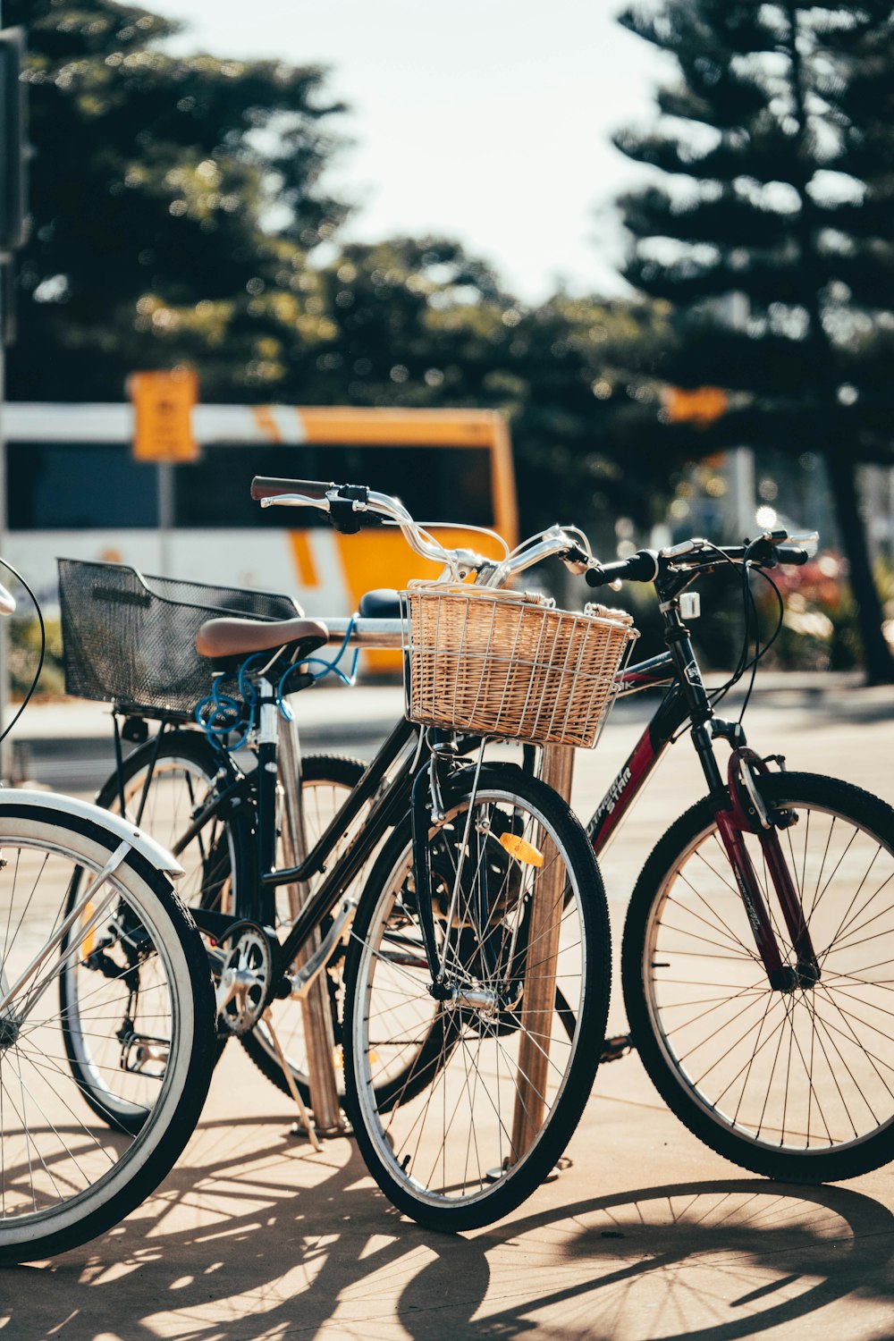 black city bike with brown basket on top