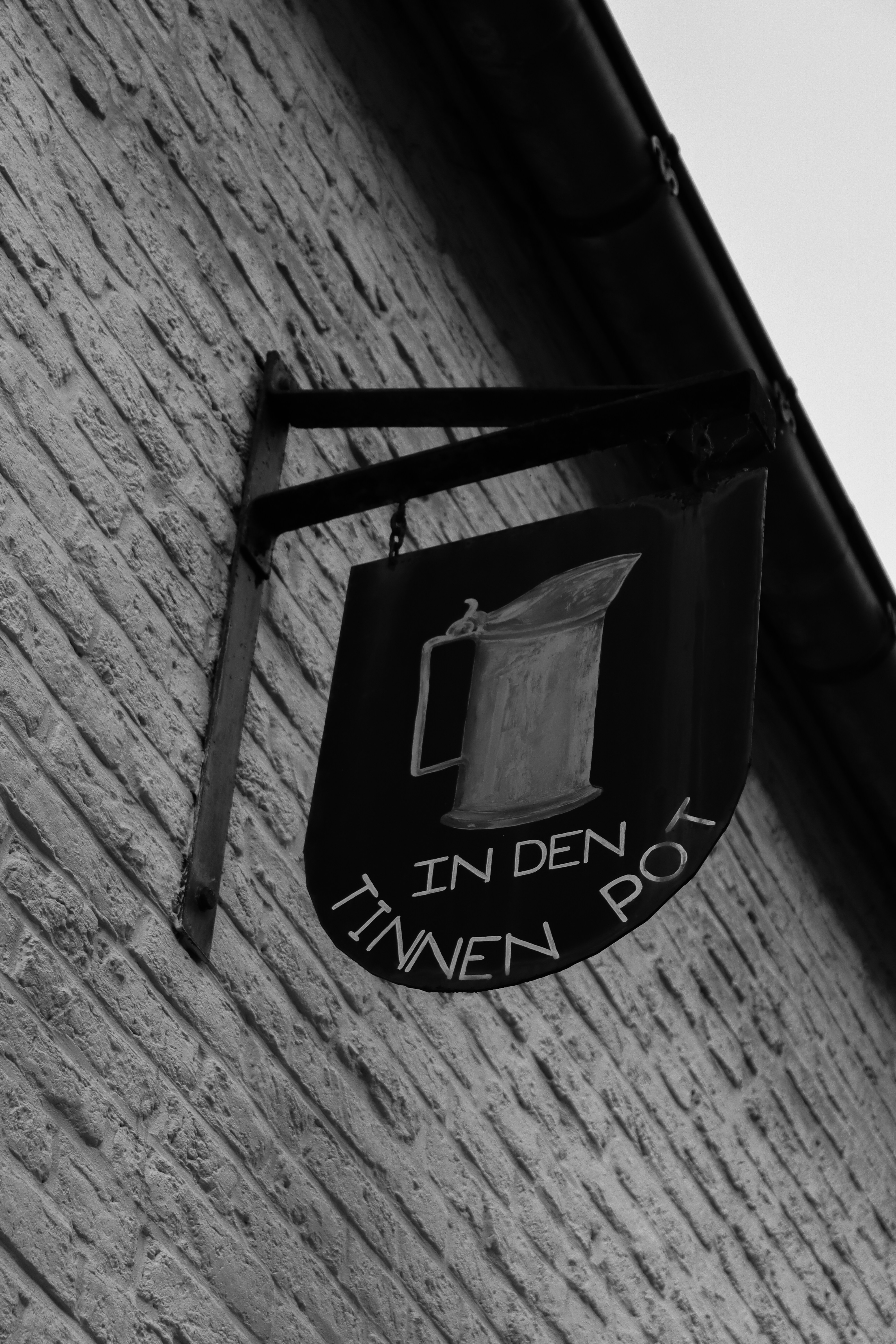 grayscale photo of black and white wooden door