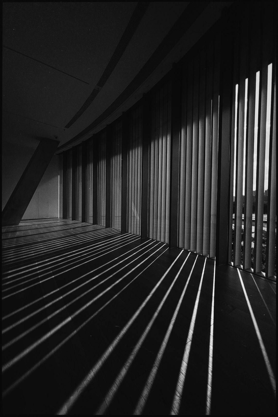 grayscale photo of a tunnel