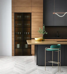 modern kitchen with wood cabinet teal stool