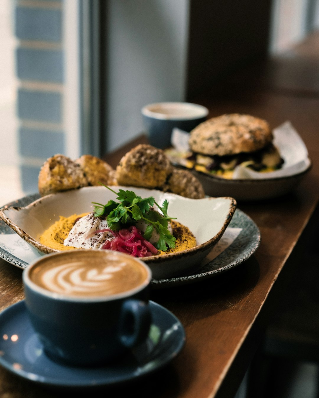 white ceramic plate with food on brown wooden table