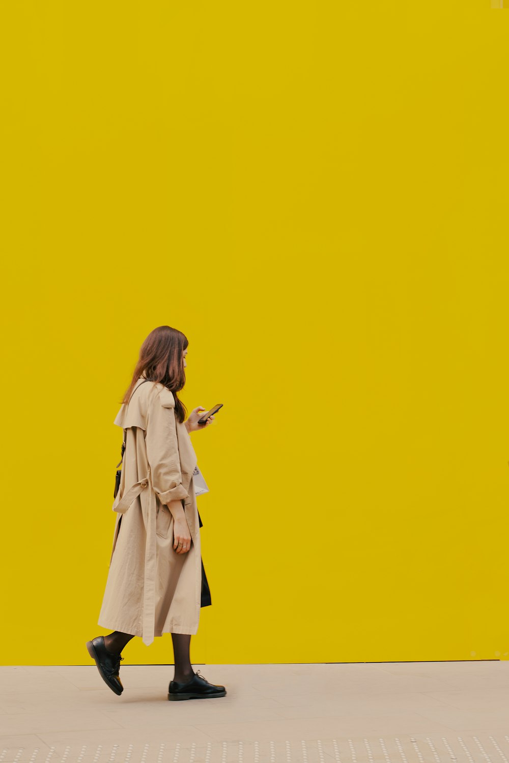 woman in yellow dress standing