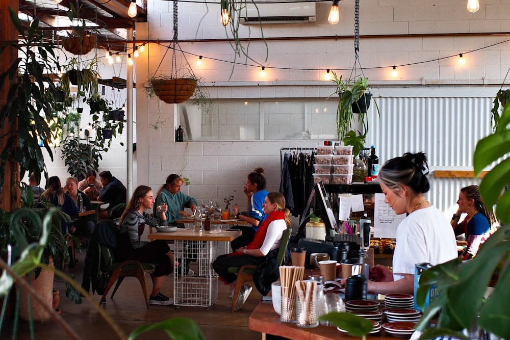 people sitting on chair in restaurant