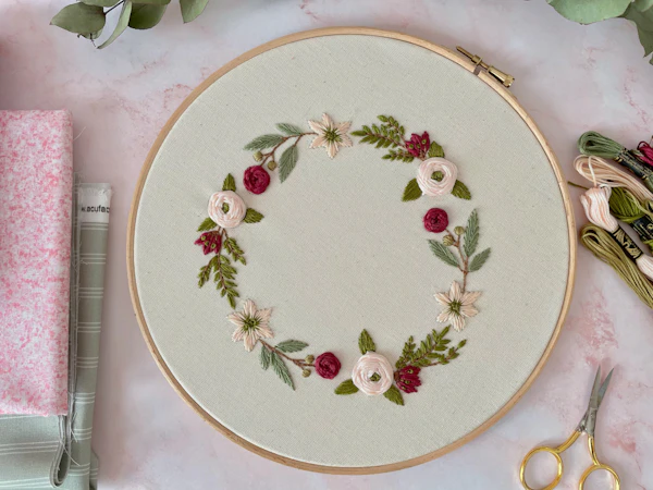 Floral embroidery stretched in a wooden hoop