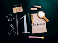 A flat lay of silkaura’s beauty accessories arranged on a marble countertop with soft natural lighting.