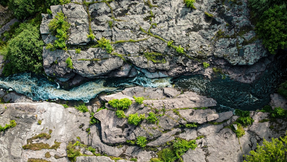 gray rocky mountain with water