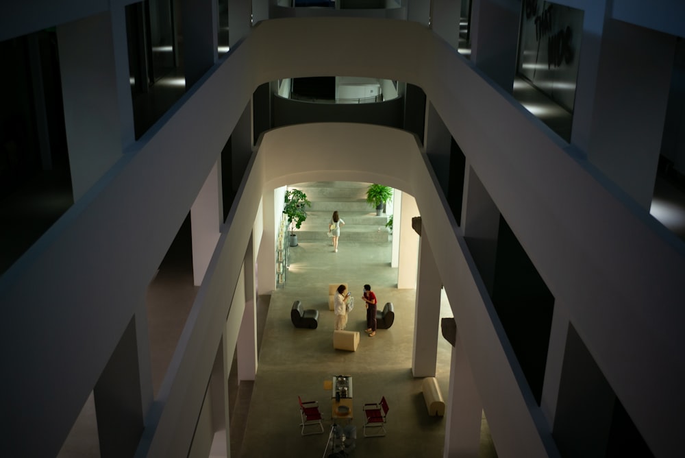 people walking on white concrete stairs