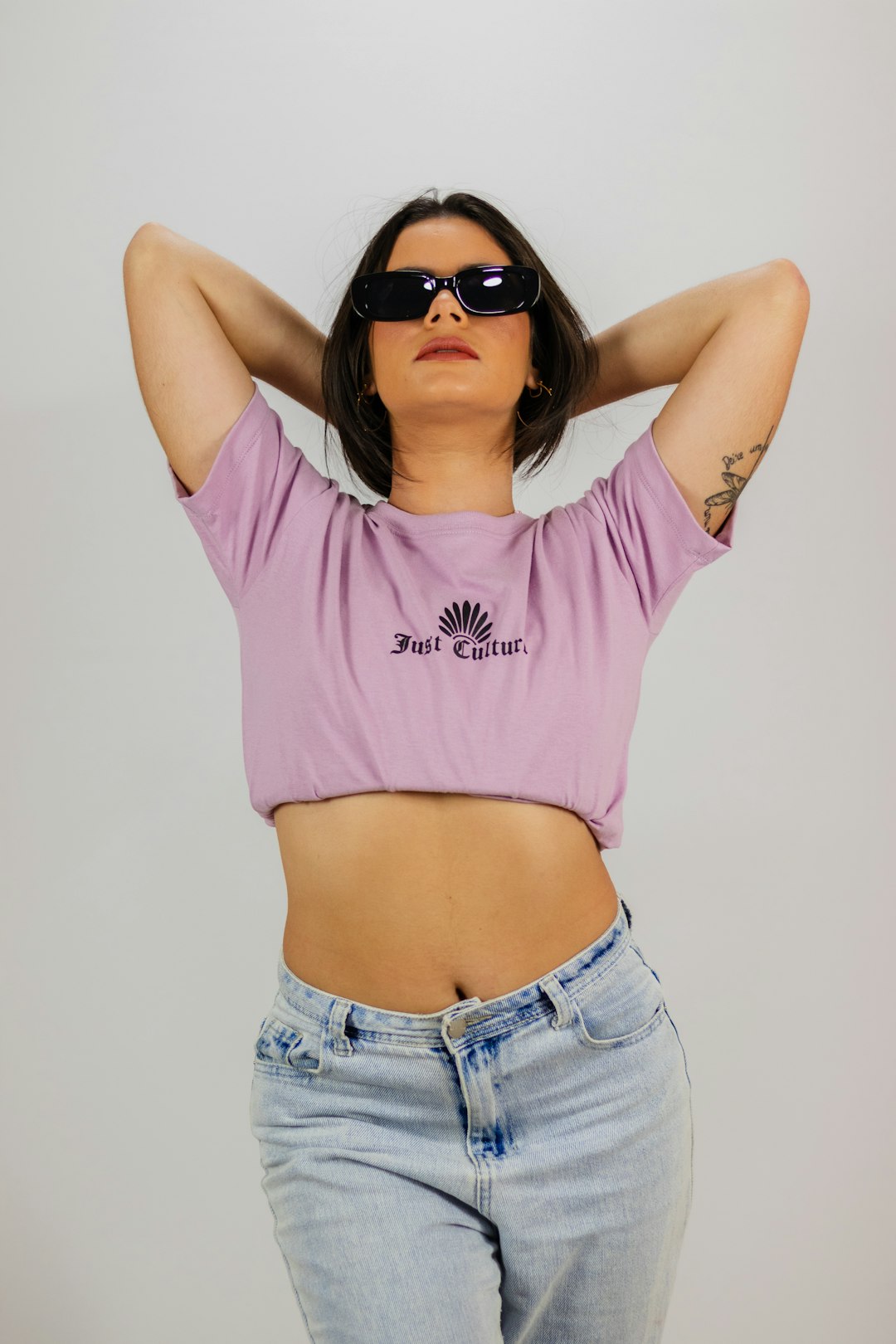 woman in pink crew neck t-shirt and blue denim shorts