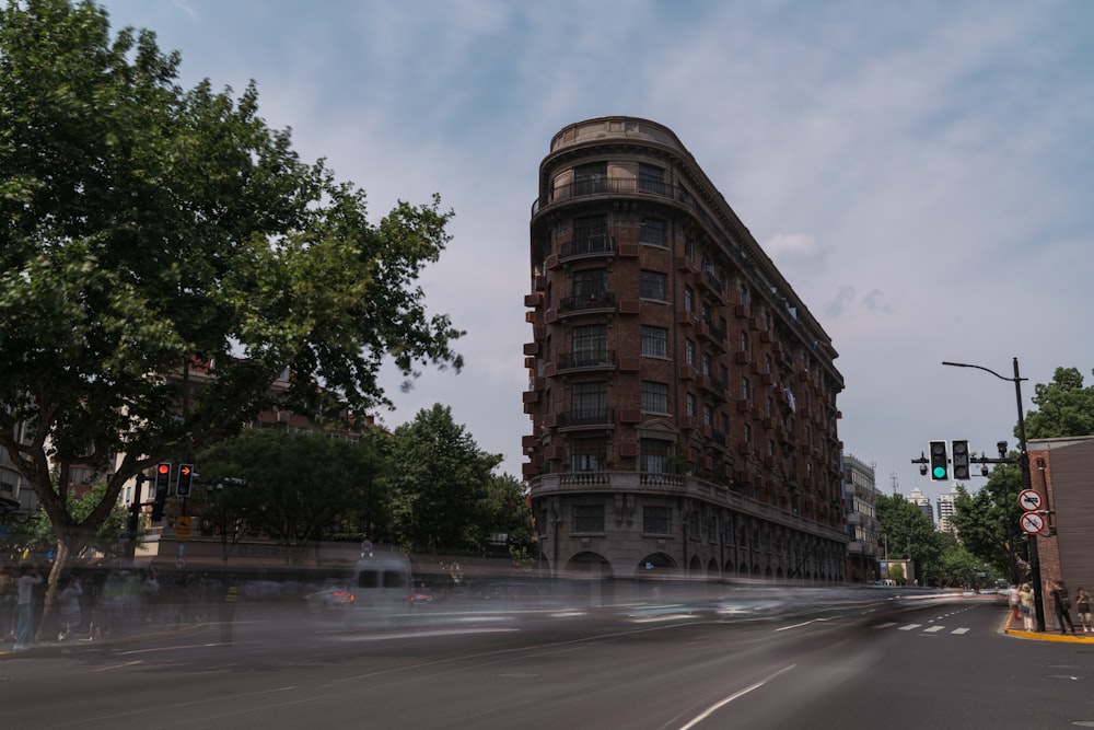 brown concrete building near green trees during daytime