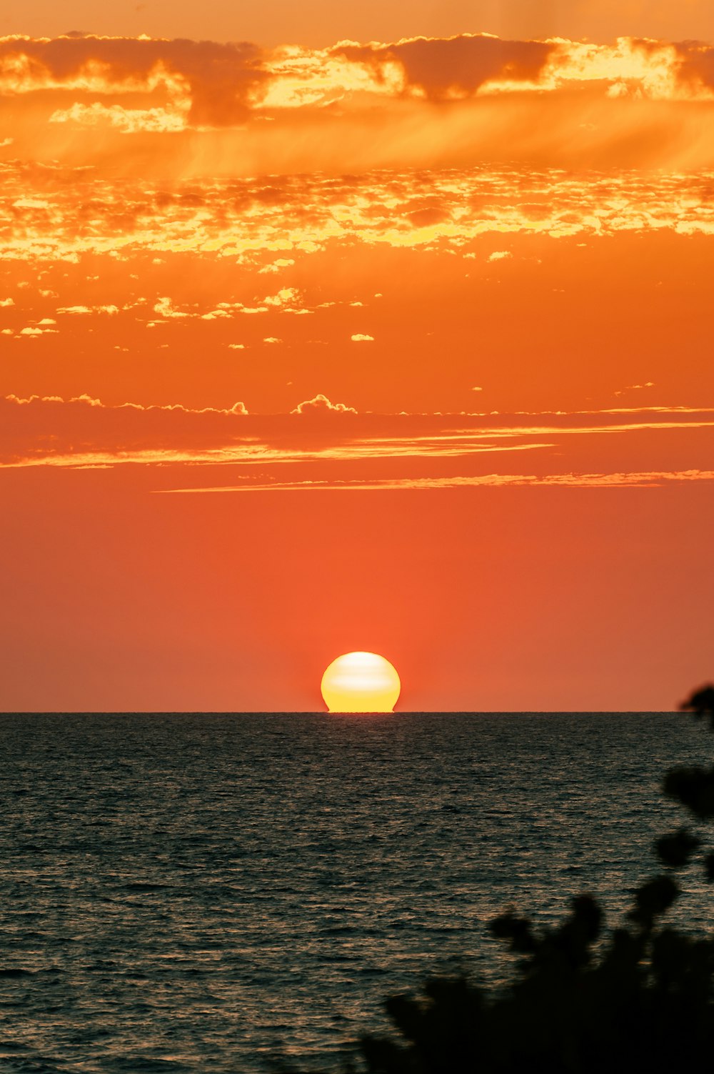 body of water during sunset