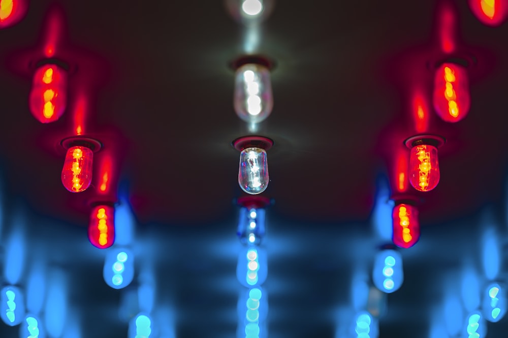 red light bulb turned on in close up photography