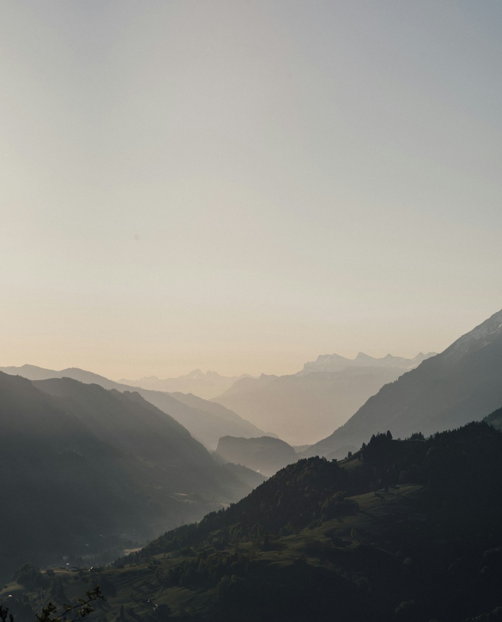 mountains under white sky during daytime