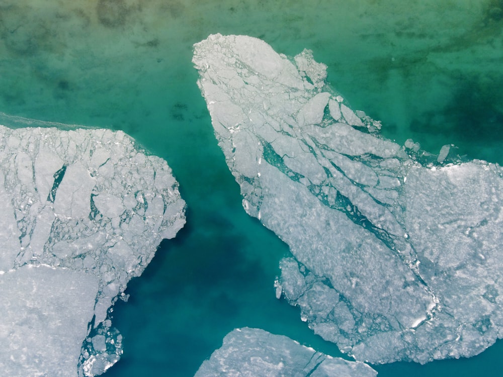 white ice on body of water