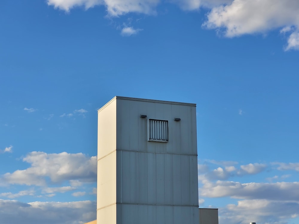 white concrete building under blue sky during daytime