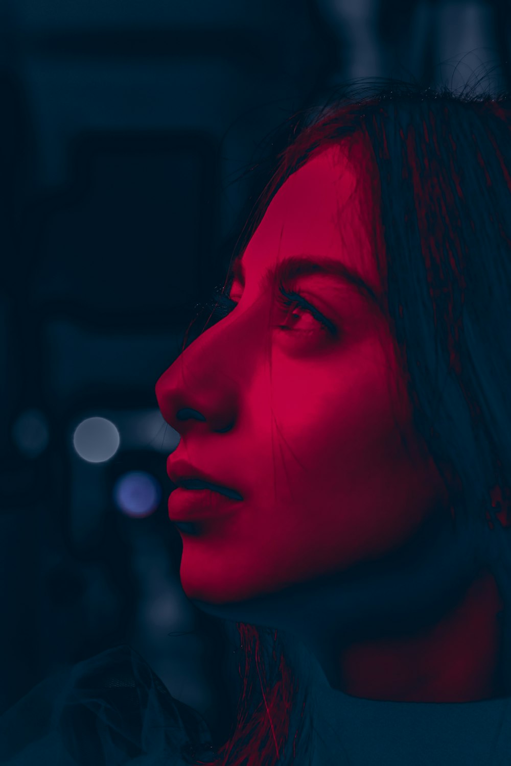 woman with red hair looking up