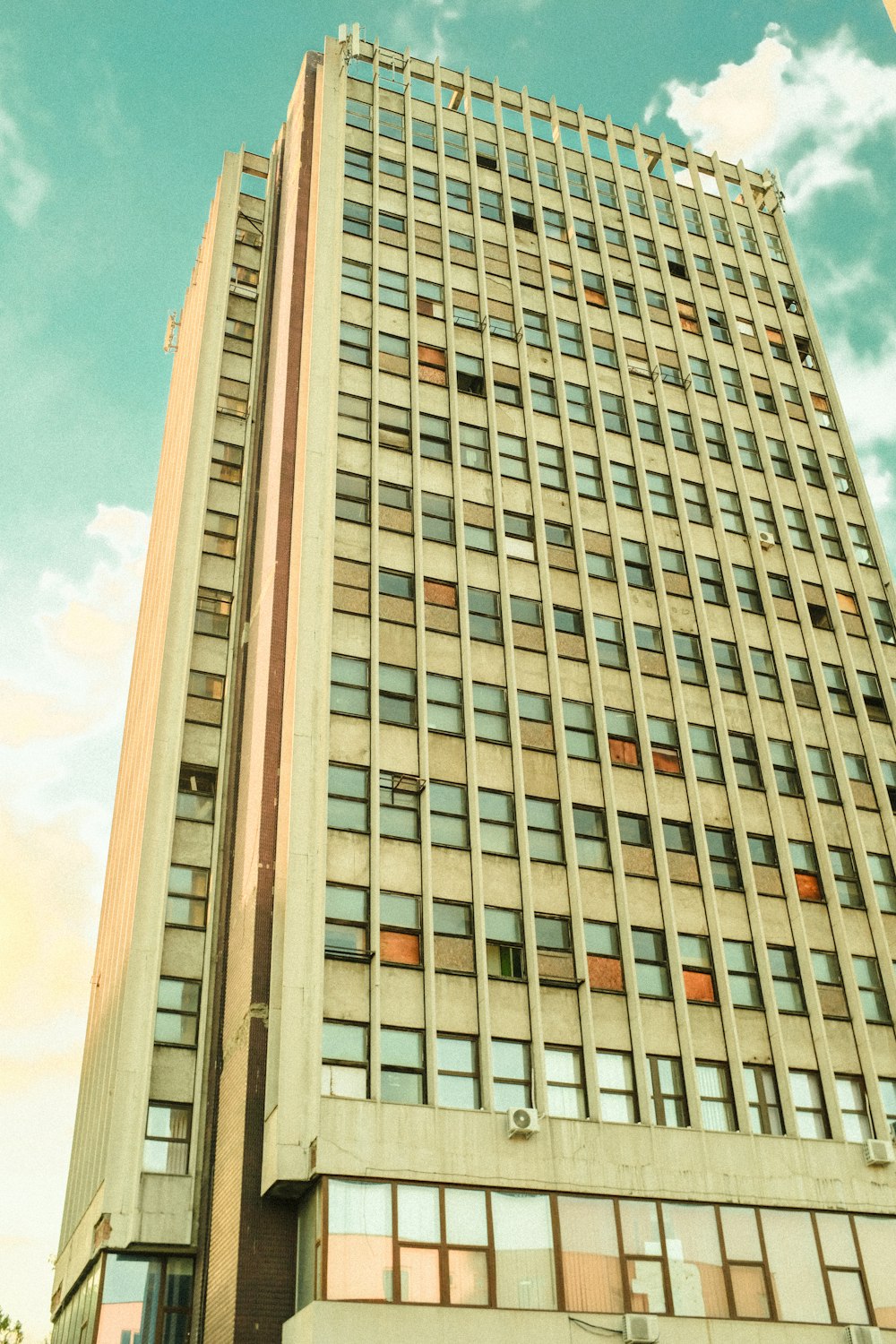 brown concrete building under blue sky during daytime