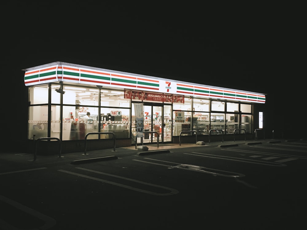 white and red concrete building during nighttime