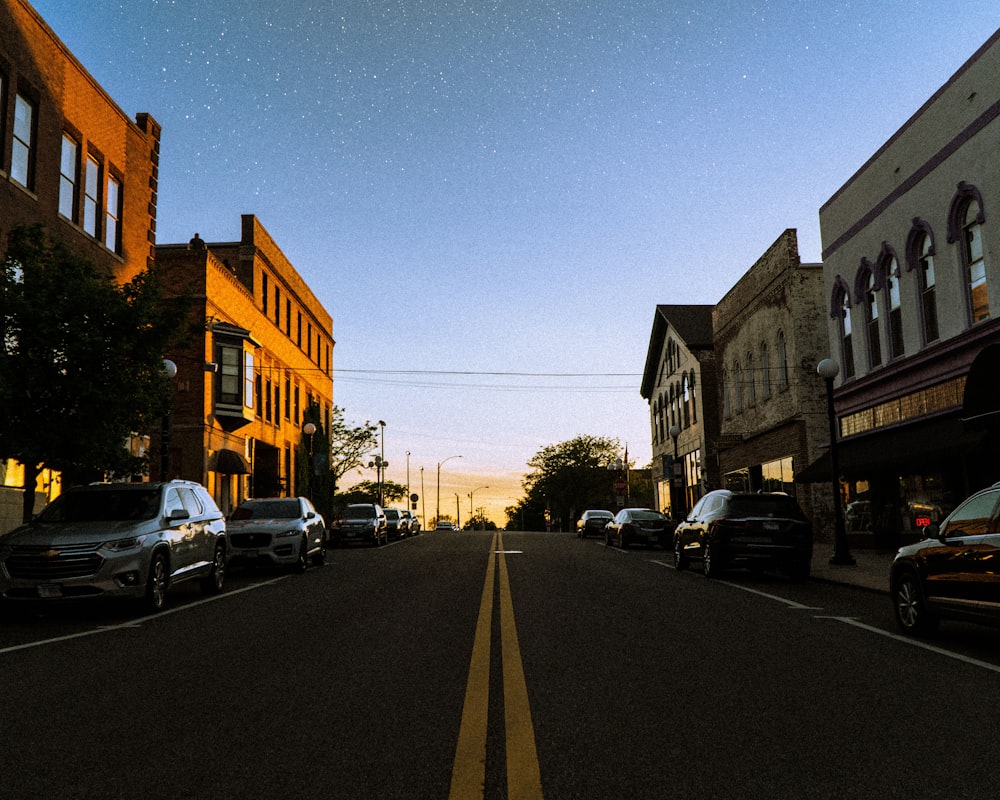 cars parked on side of the road during night time