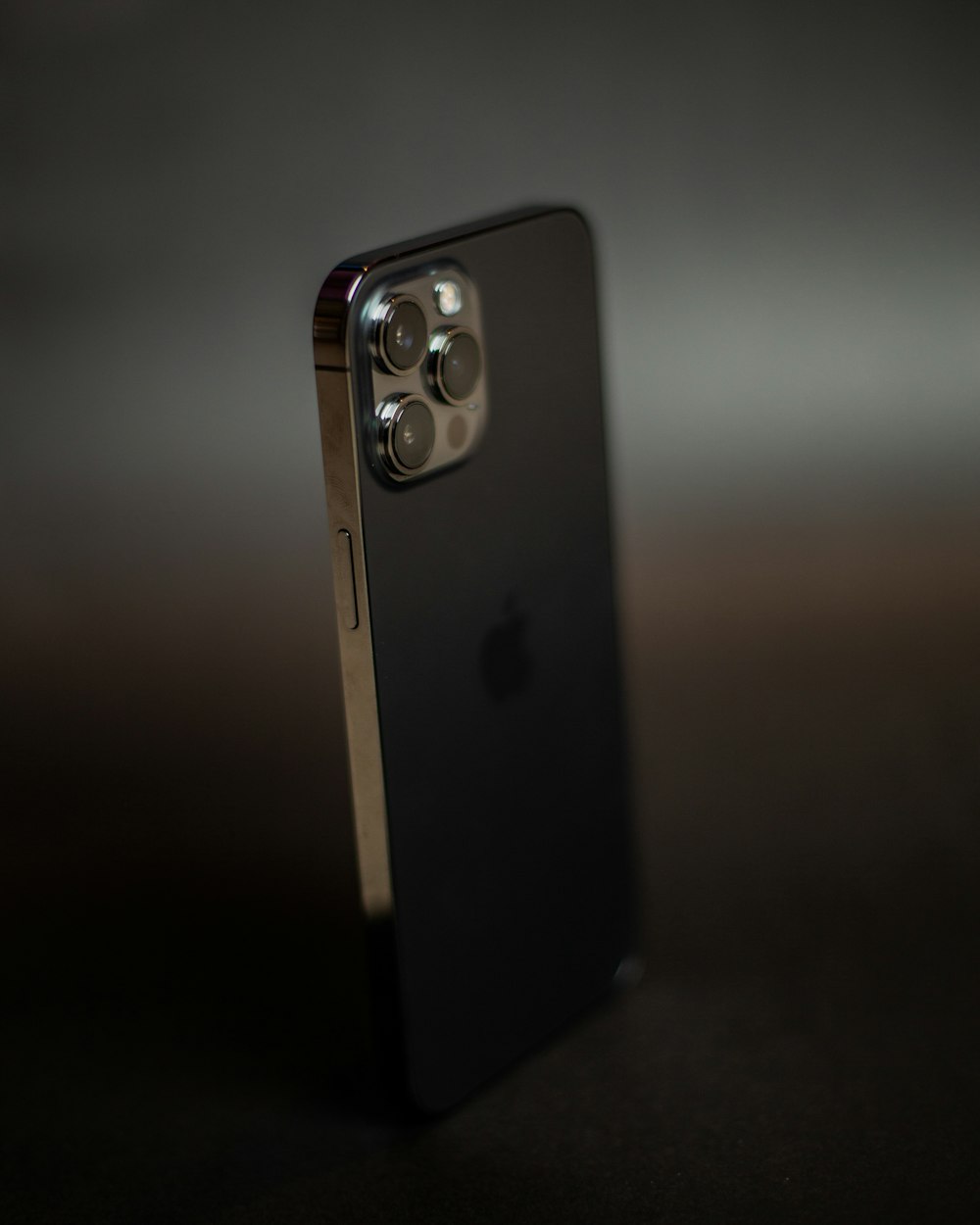 black and silver smartphone on black table