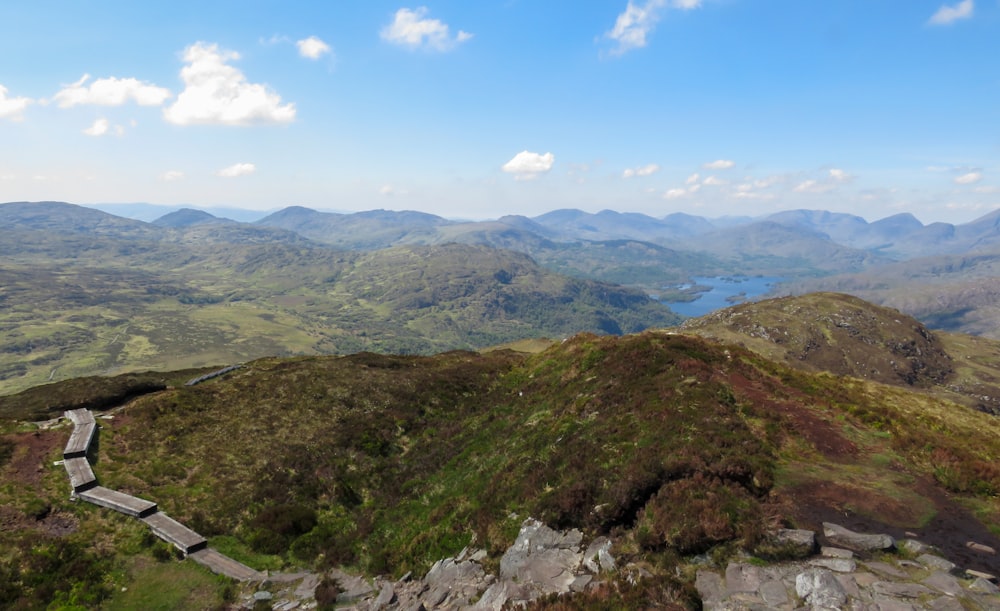 green and brown mountains under blue sky during daytime