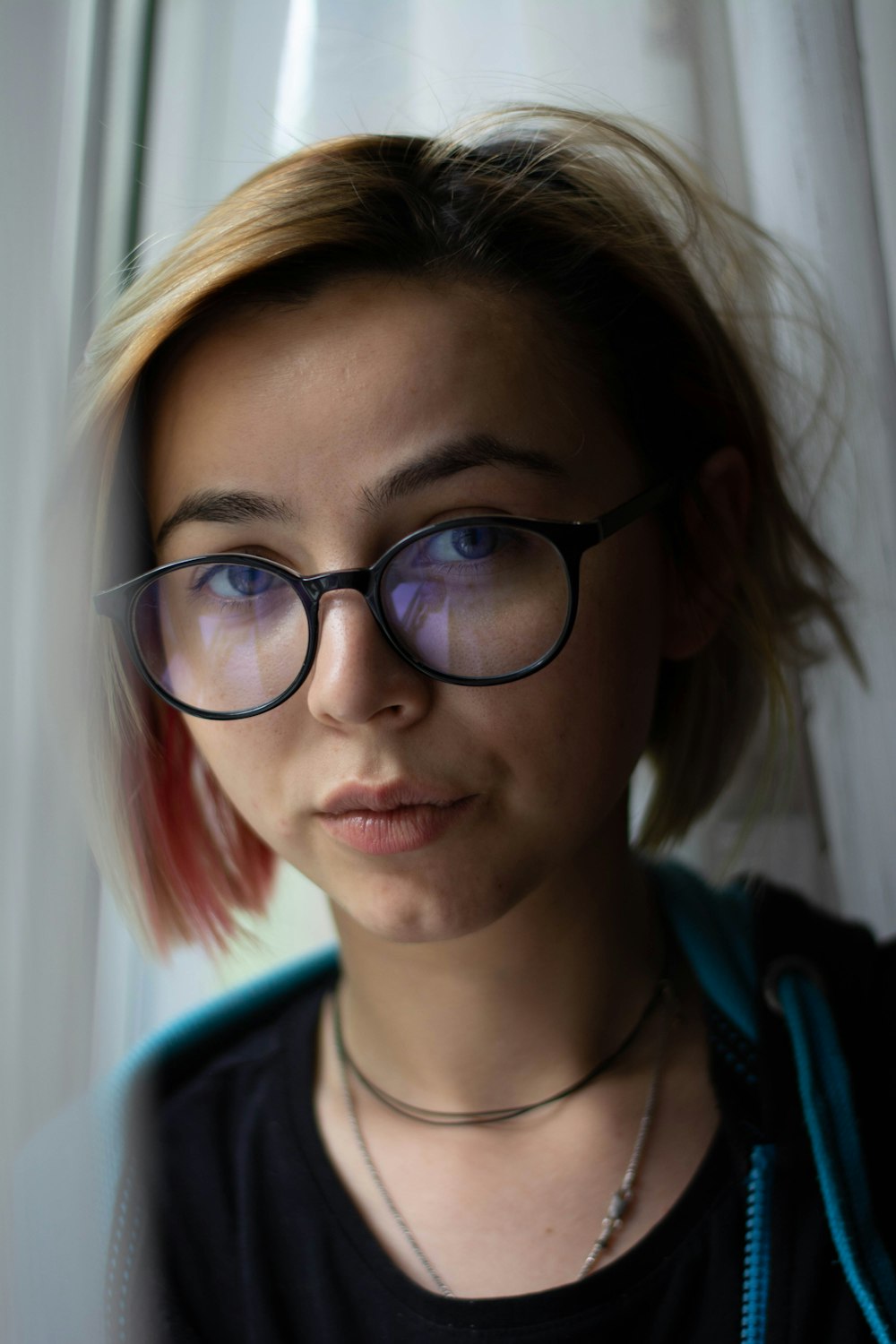 woman in black framed eyeglasses