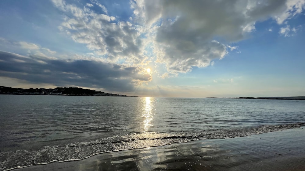 body of water under blue sky during daytime